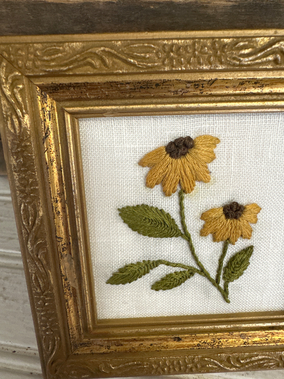 Hand embroidered flowers in wooden frame