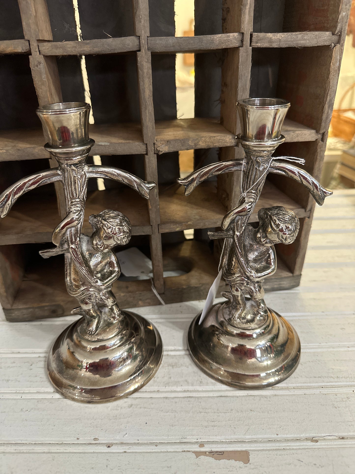 Silver plated cherub candlesticks