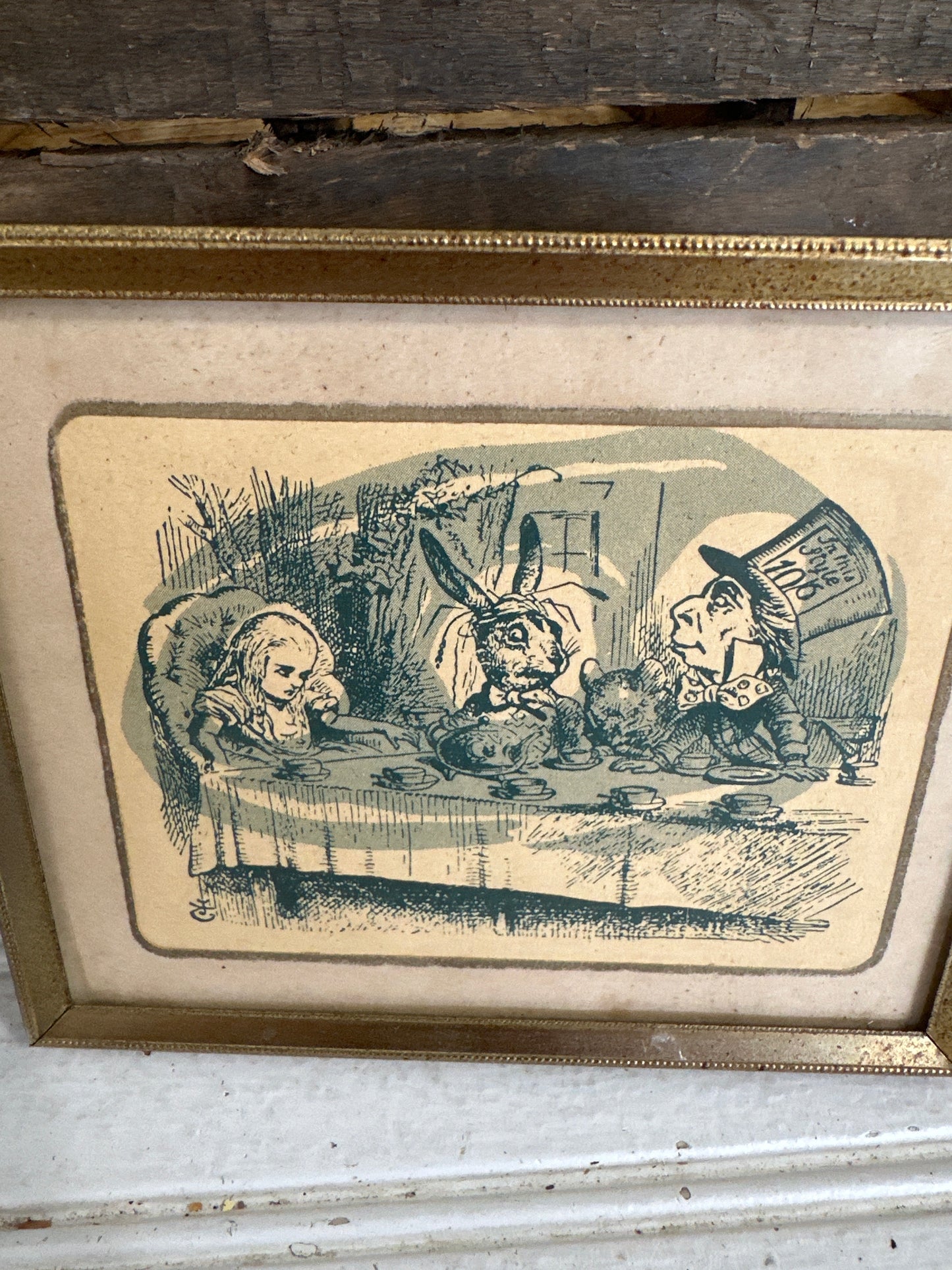 Vintage Alice in Wonderland book page framed in Vintage Metal frame
