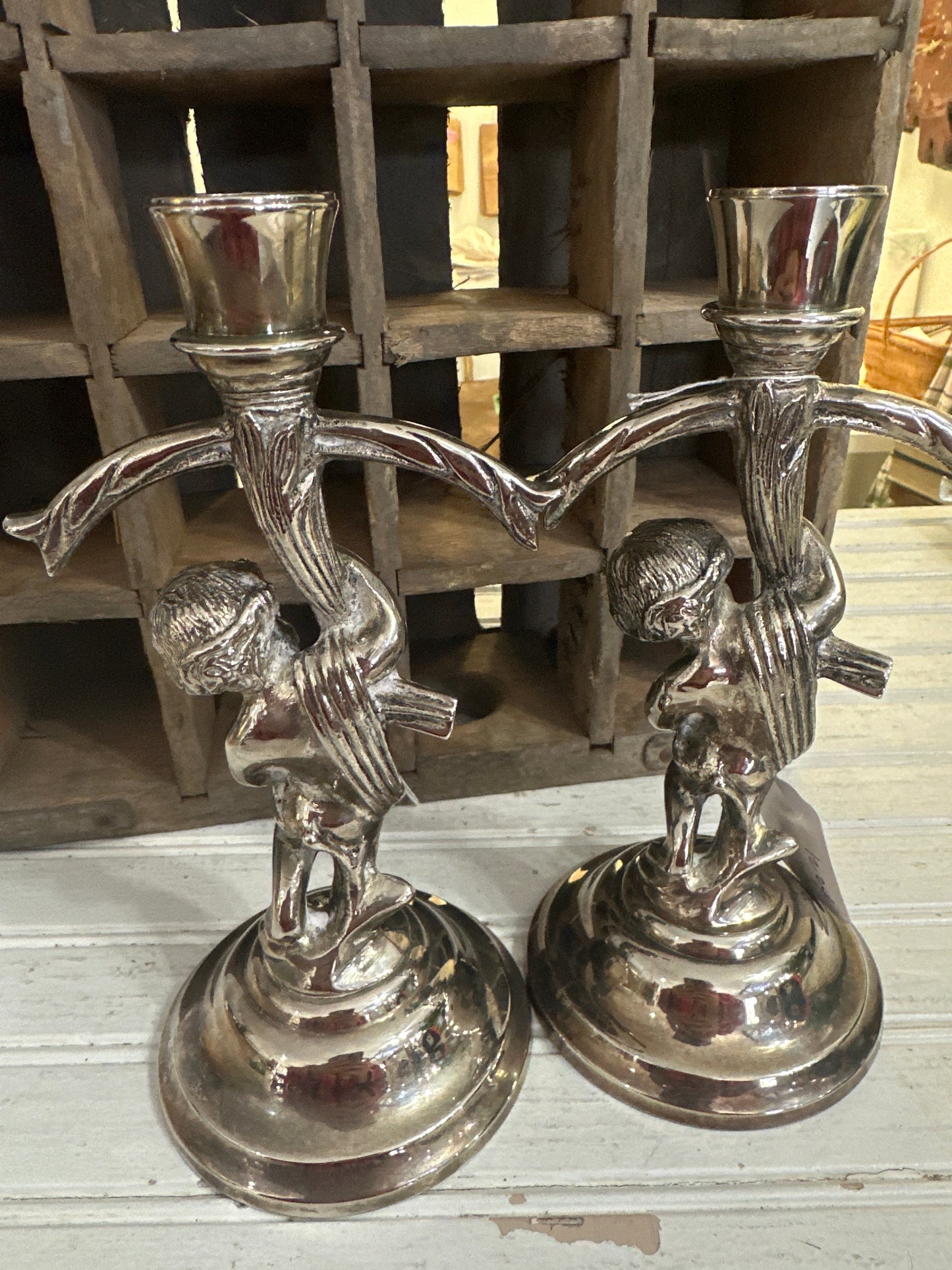 Silver plated cherub candlesticks