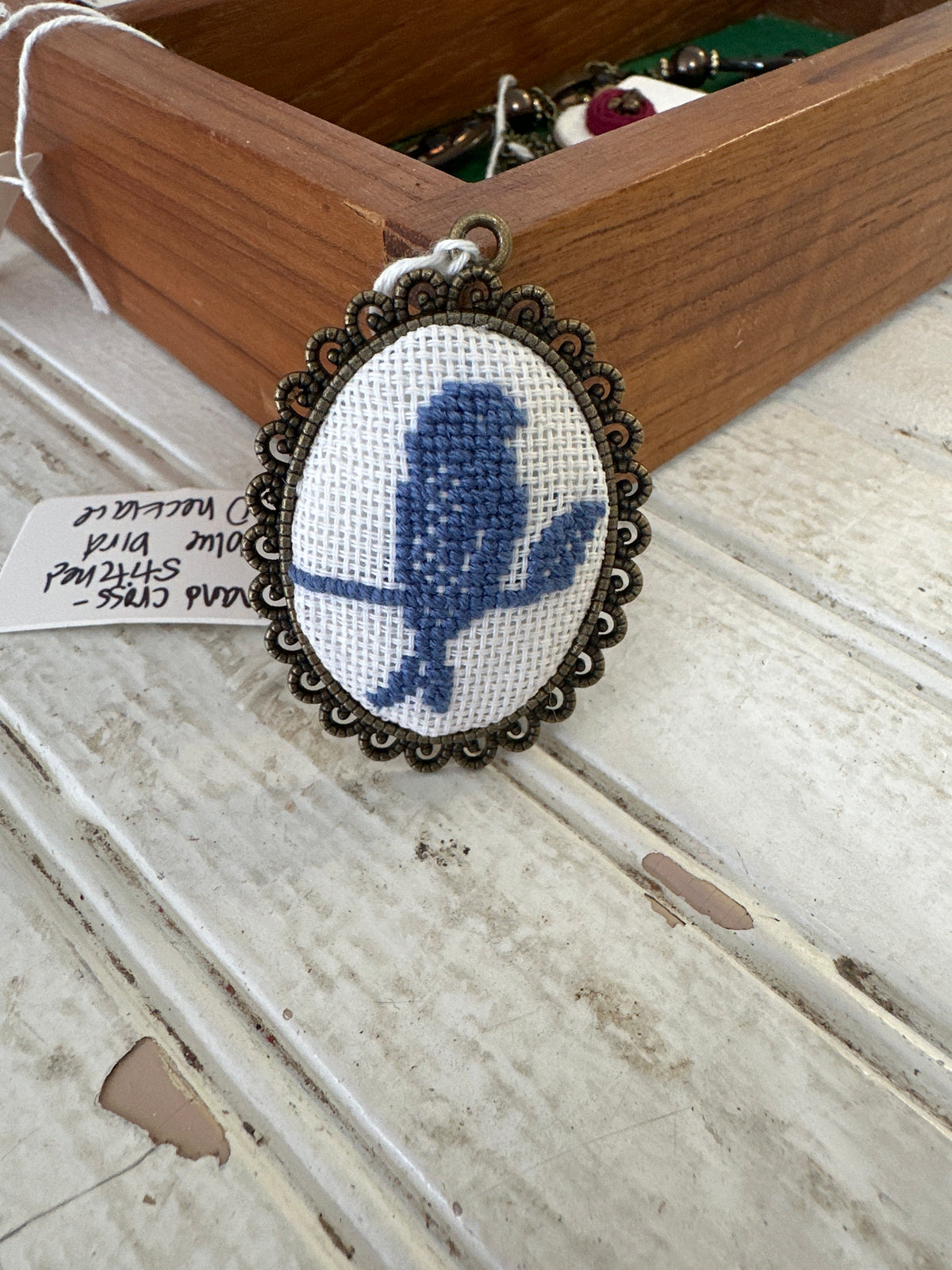 Hand Cross-stitched blue bird necklace