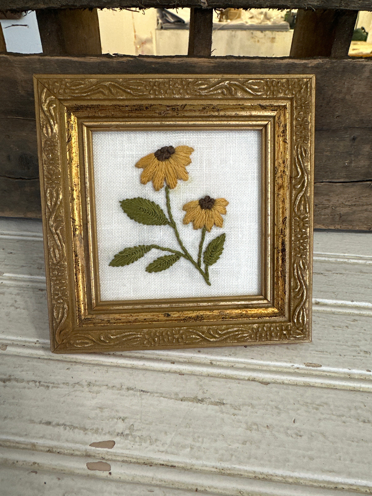 Hand embroidered flowers in wooden frame