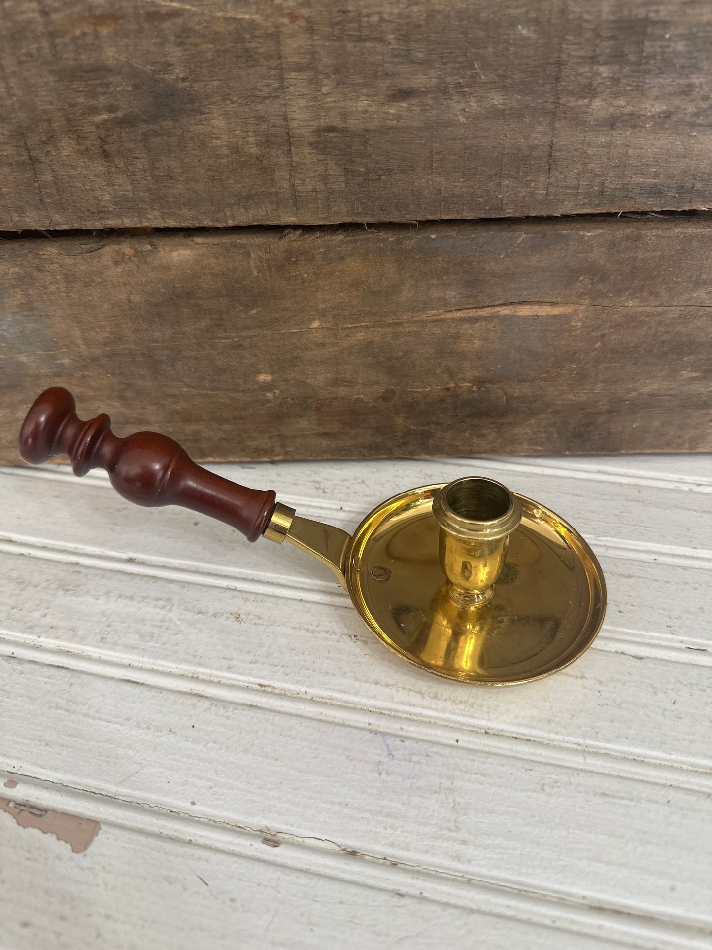 Brass candle holder with wood handle