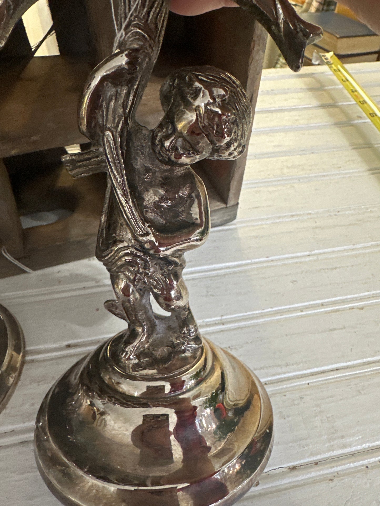 Silver plated cherub candlesticks