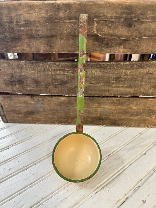 Green trimmed enamel ladle