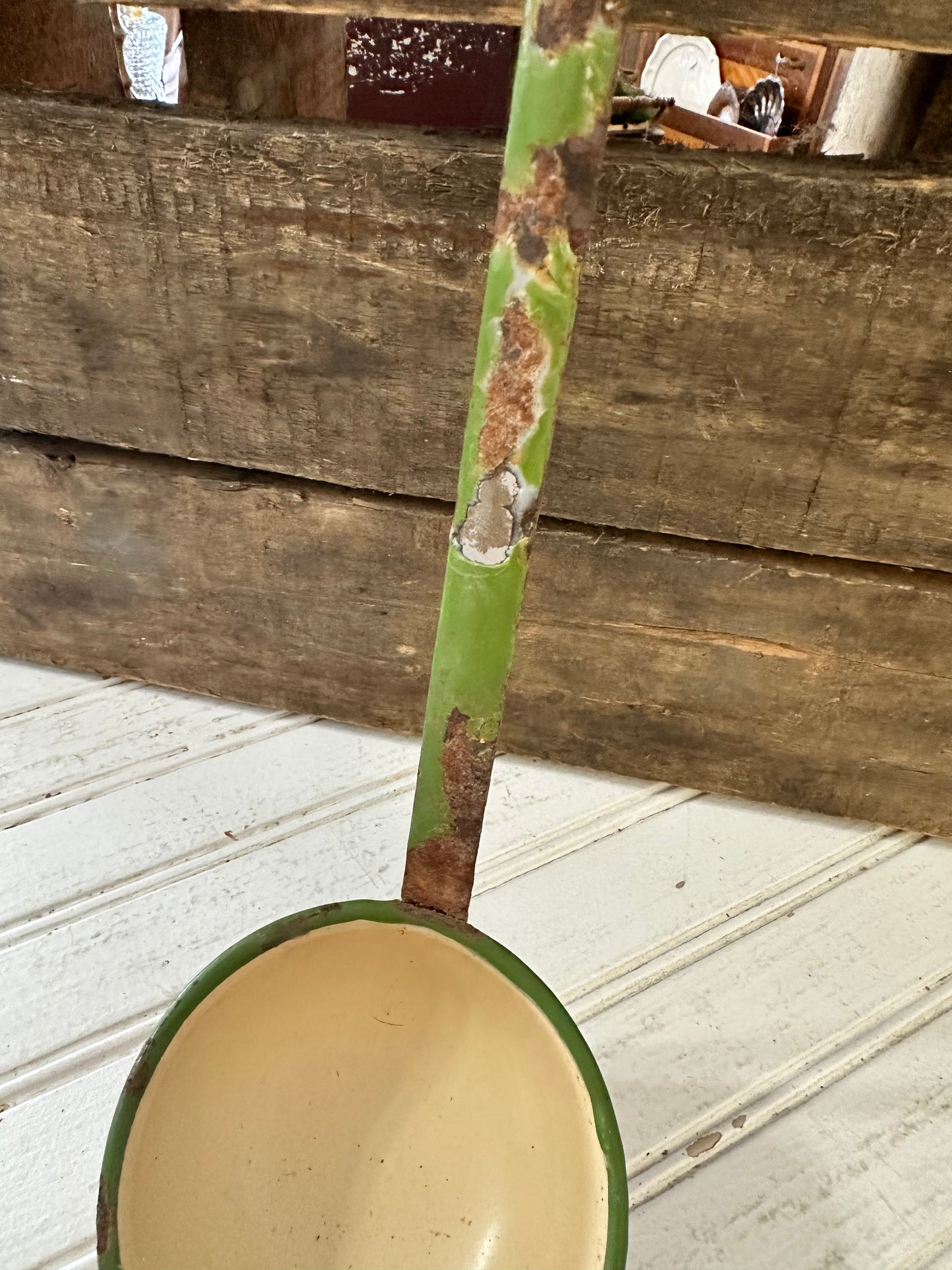 Green trimmed enamel ladle