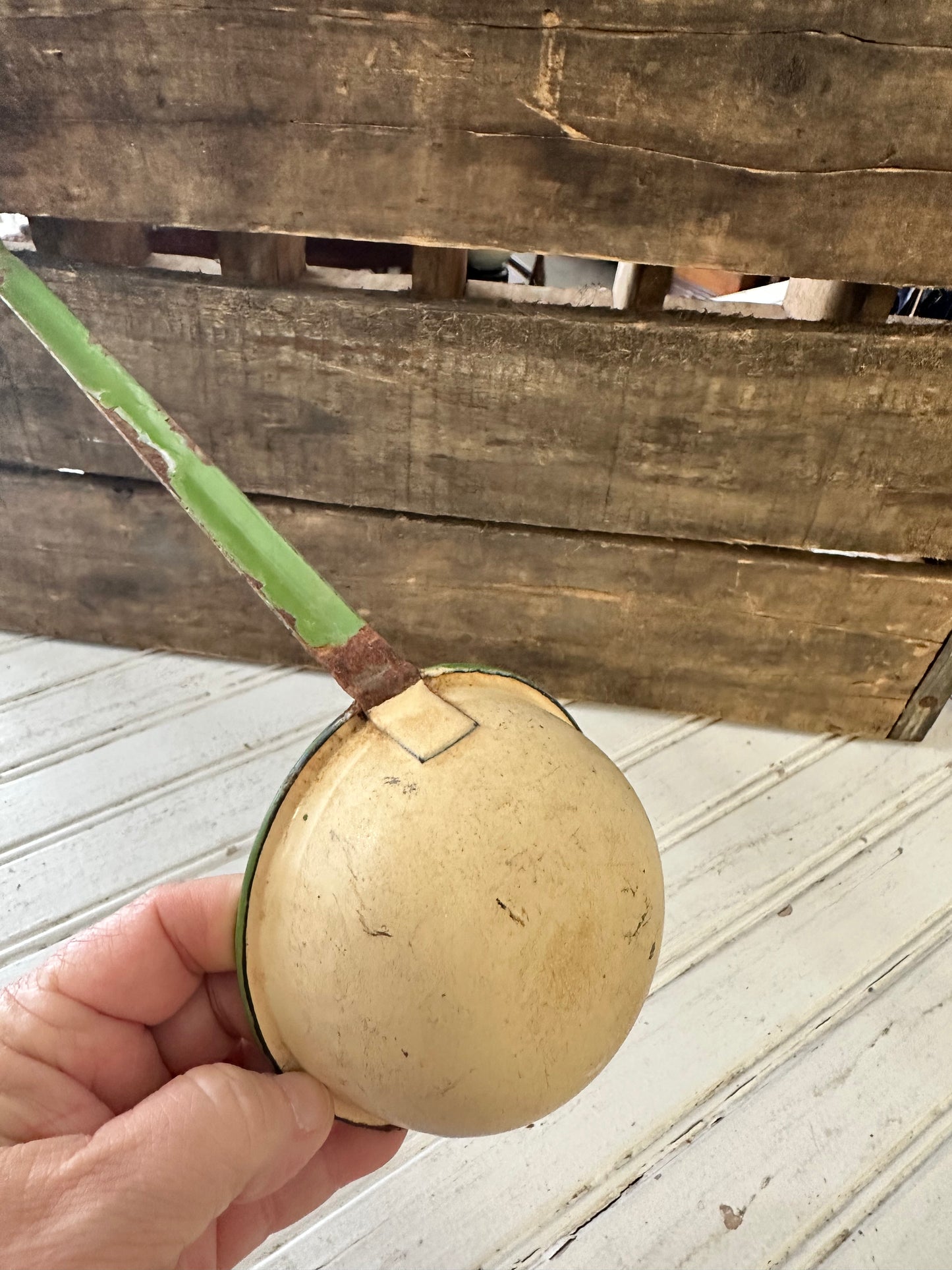 Green trimmed enamel ladle