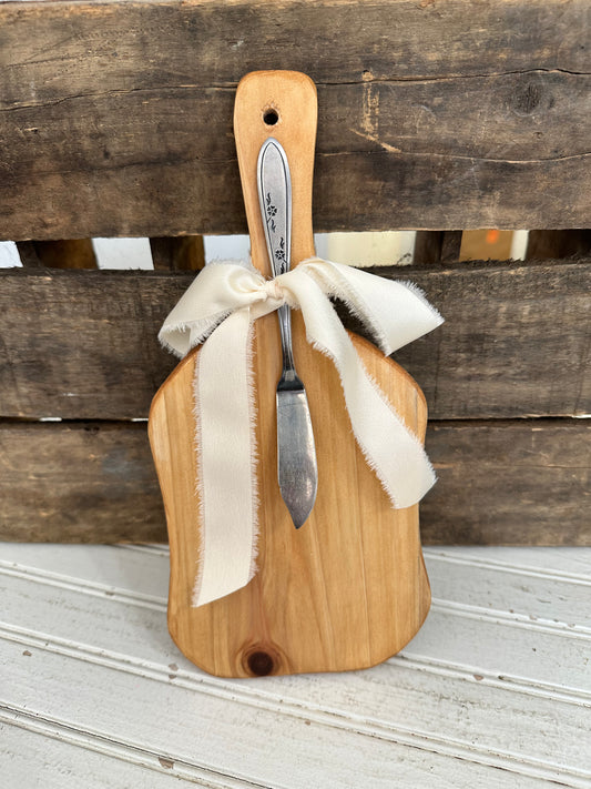 Handmade wood bread board with silver plate butter knife