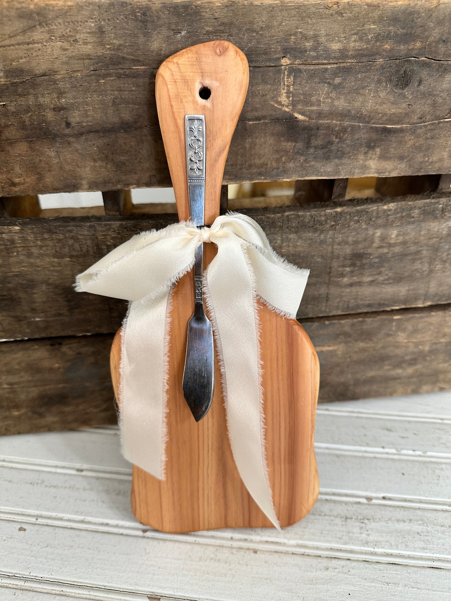 Handmade wood bread board with silver plate butter knife