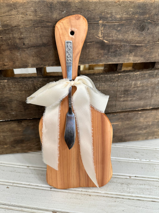 Handmade wood bread board with silver plate butter knife