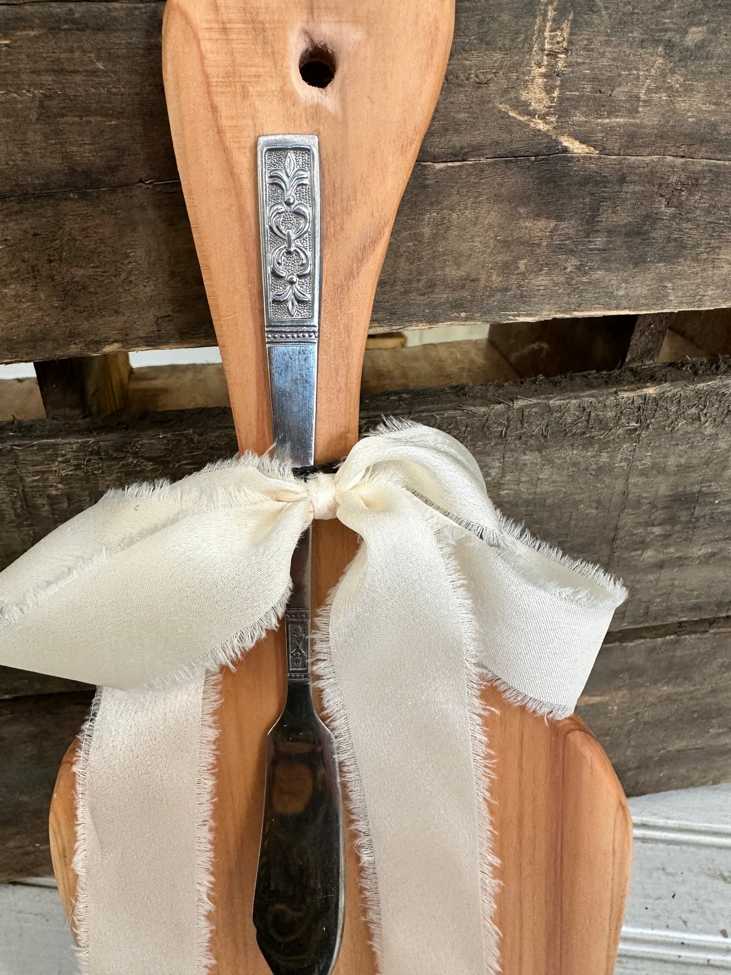 Handmade wood bread board with silver plate butter knife