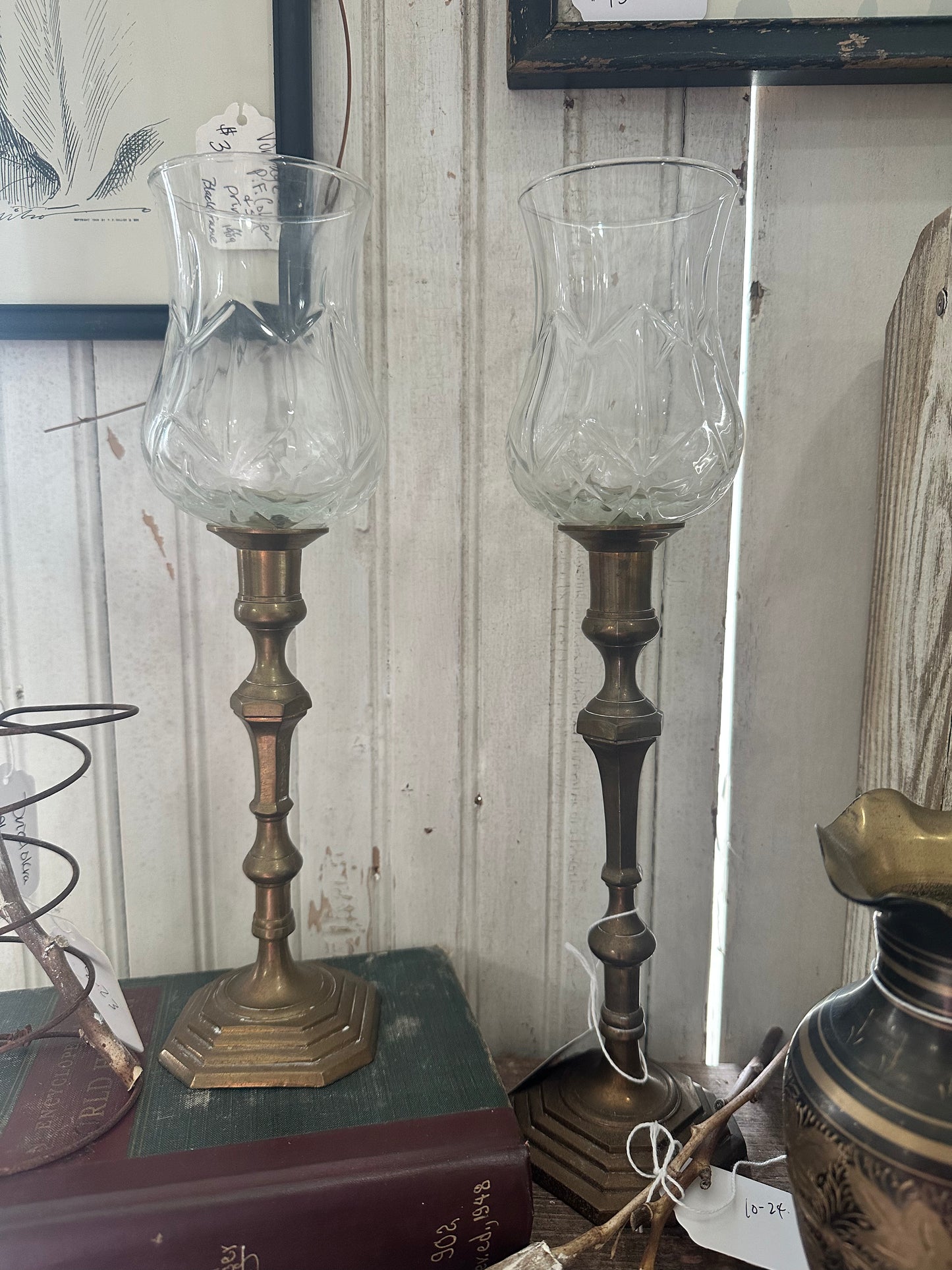 Brass candle holders with glass votive tops